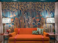 Lounge With Bright Sofa With Colorful Art Deco Patterned Wallpaper