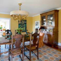 Yellow Dining Room With Orange And Gray Area Rug
