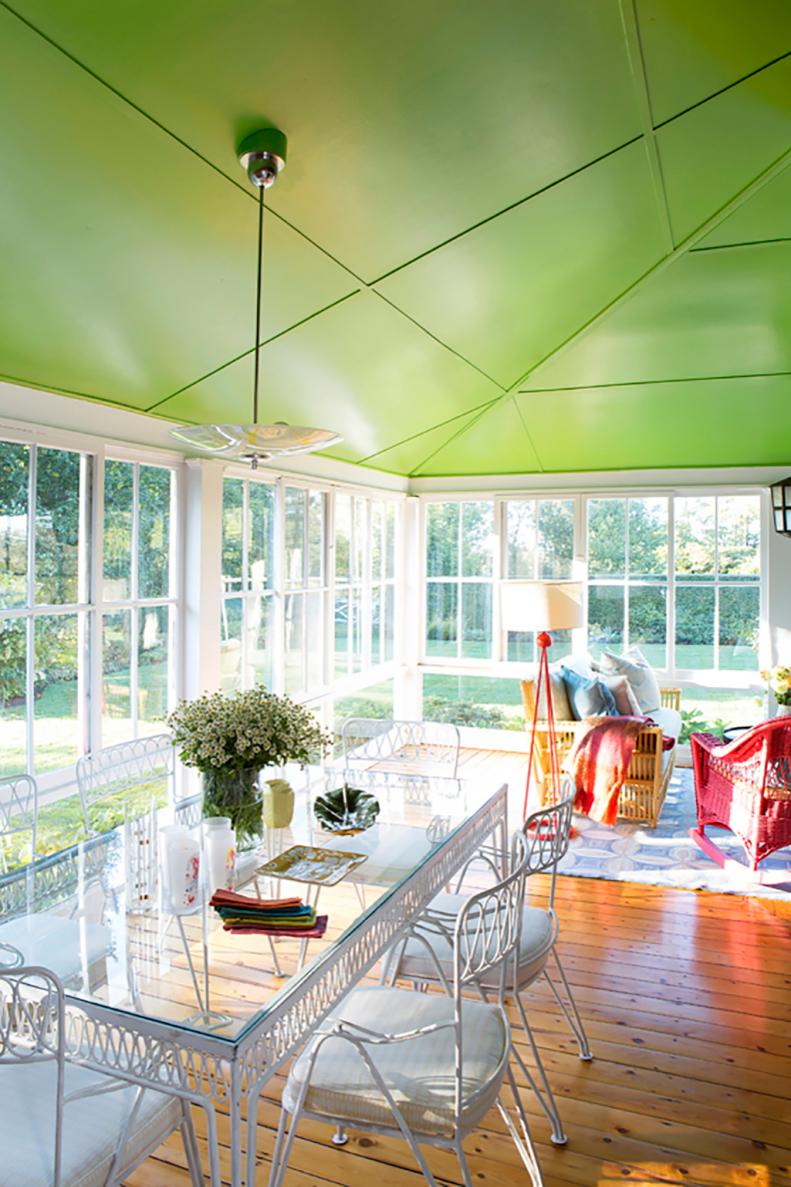 Glass Dining Table For Eight In Covered Porch With Wrap-Around Windows