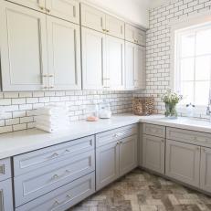 Luxurious Laundry Room With Tiled Accents