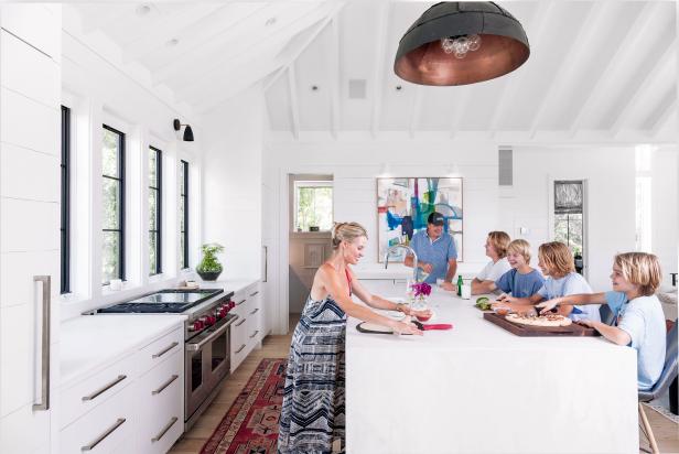 With four boys from 12 to 17 (and dog Lucy), downsizing from a 4700 square foot home to a 2600 square foot one, meant that Elizabeth and Curt Nesbitt had to be smart about their space. Their stunning, contemporary Sullivan's Island home on the lush green marsh of the Intracoastal Waterway benefits from an airy, open living room, dining room and kitchen on the home's second floor. Floor to ceiling windows let the light flood in and make the space appear even more expansive. Designer Jenny Keenan worked with the Nesbitts on the smart, chic design of their spacious-feeling home.