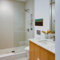 Modern Neutral Bathroom With Pebble Flooring