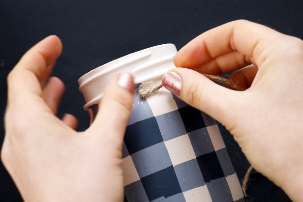 Hot glue twine around the rim of the jar. Tie a small bow from a scrap of twine and glue to the front of the jar.