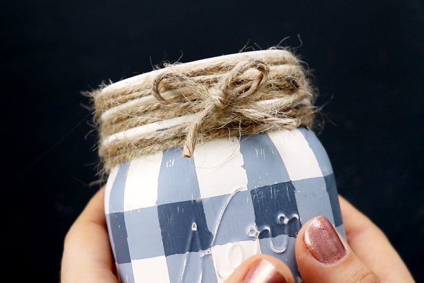 Hot glue twine around the rim of the jar. Tie a small bow from a scrap of twine and glue to the front of the jar.