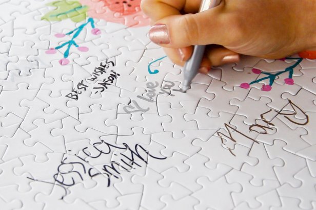 At the wedding, provide permanent markers for your guests to sign the puzzle.
