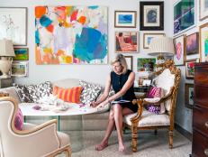 Former Manhattanite and now Charleston-based jewelry designer Janet Gregg is a vivacious, engaging woman-about-town whose beautiful home perfectly encapsulates her personal style: bold, colorful and globe-trotting meets preppy. Her living room feature an array of colorful artwork,  much of it purchased on trips abroad.