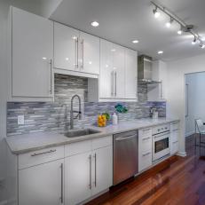 Sleek Modern Kitchen With Counter-To-Ceiling Backsplash  