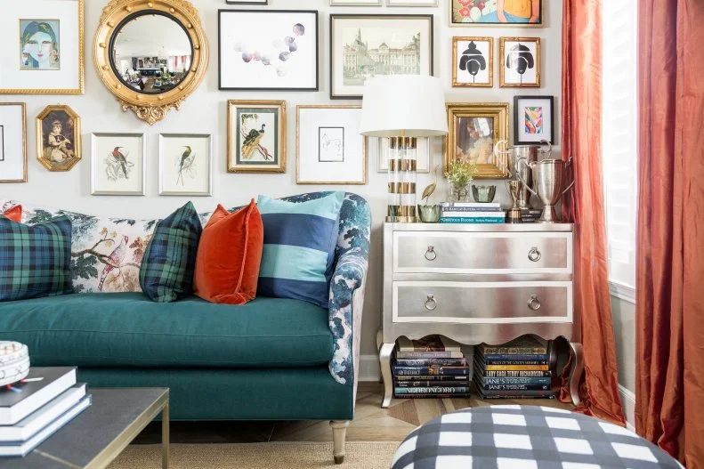 Full Gallery Wall In Eclectic Living Room With Metallic Dresser Table