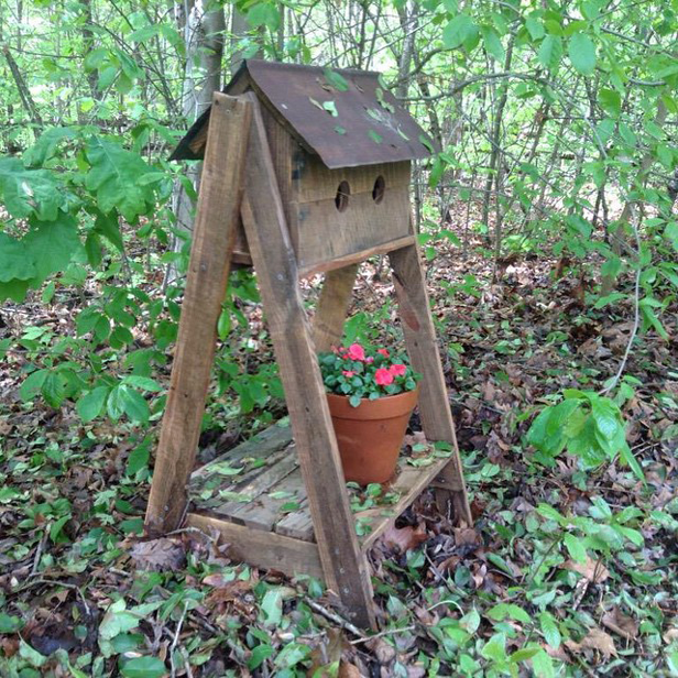 Rustic Wooden Birdhouse With Shelf for Flower Pot in Forest