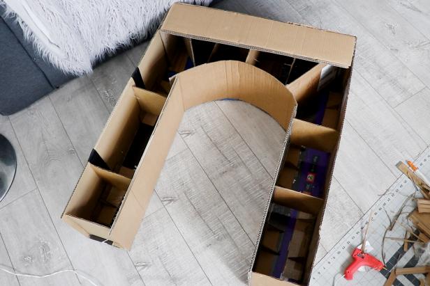 Repeat steps from step 3 to add cardboard rectangles to the outside of the fireplace. Reinforce with cardboard supports as needed so the fireplace keeps its shape.