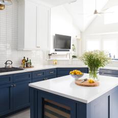 Bright Blue And White Kitchen With Rectangular Island