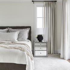 Neutral Transitional Bedroom With Black Lamp