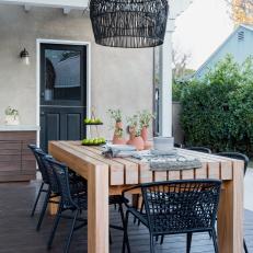 Outdoor Patio With Pergola And Woven Pendant Light