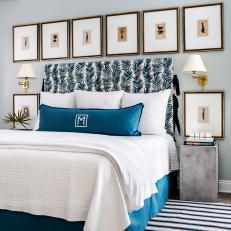 Modern Master Bedroom In Blue With Framed Art
