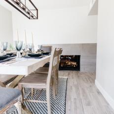 Rustic, Modern Dining Room With Tiled Fireplace
