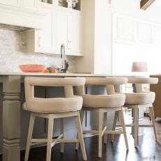 White Open Plan Kitchen With Curved Back Stools