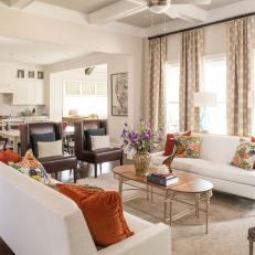 Transitional Neutral Living Room With Orange Pillows