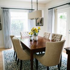 Transitional Dining Room With Blue Rug
