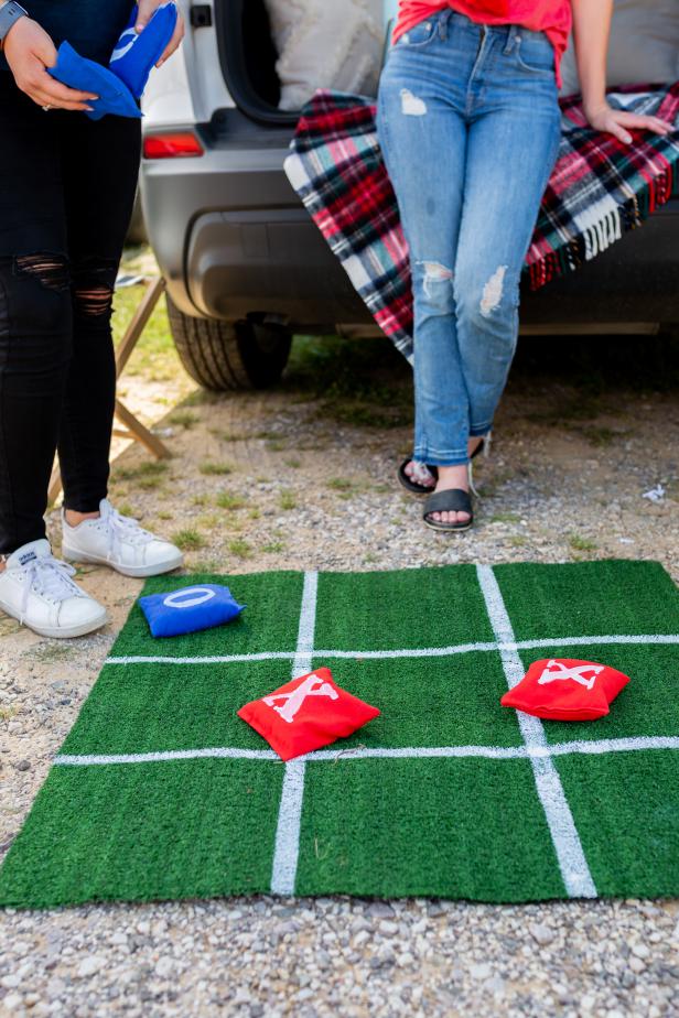 An Astroturf Tic Tac Toe Board Sitting On the Ground