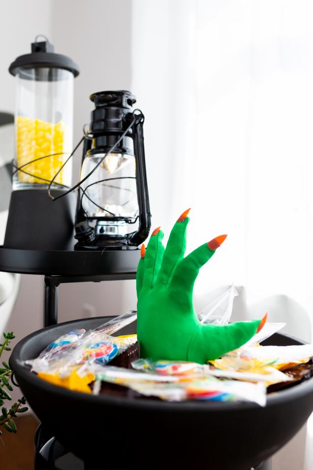 A Monster Hand Candy Bowl Made From a Green Glove