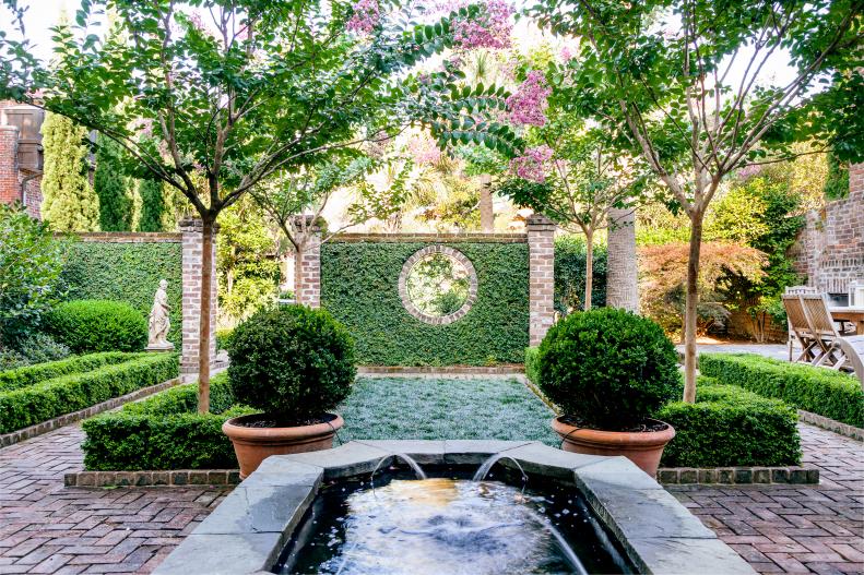 An oasis of calm in the genteel city of Charleston, Peggy and Woody Rash's garden is ideal for parties with its lovely water feature, multiple outdoor rooms, trees for shade and a brick patio that won't tangle up high heels.