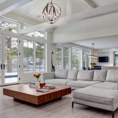 White Open Plan Living Room With Pond View