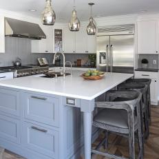 Gray and White Kitchen With Silver Pendants