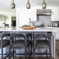 Gray and White Kitchen With Wood Barstools