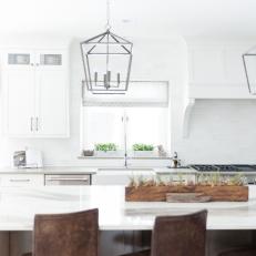 White Open Plan Kitchen With Lantern Pendants