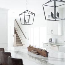 White Open Plan Kitchen With Leather Barstools