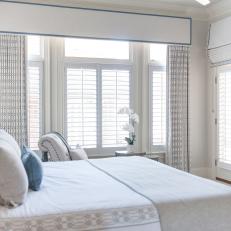 Blue and White Transitional Master Bedroom With Orchid
