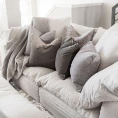 White Sofa With Gray Pillows