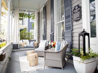 Front Porch Charm With Cushioned Seats And Large Porch Swing