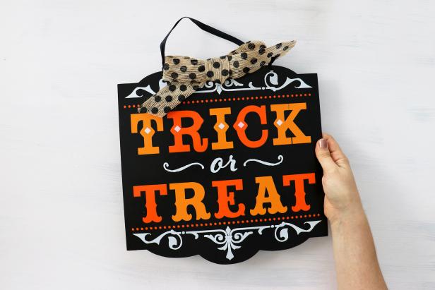 A cheap Halloween sign can be customized with any message or design.