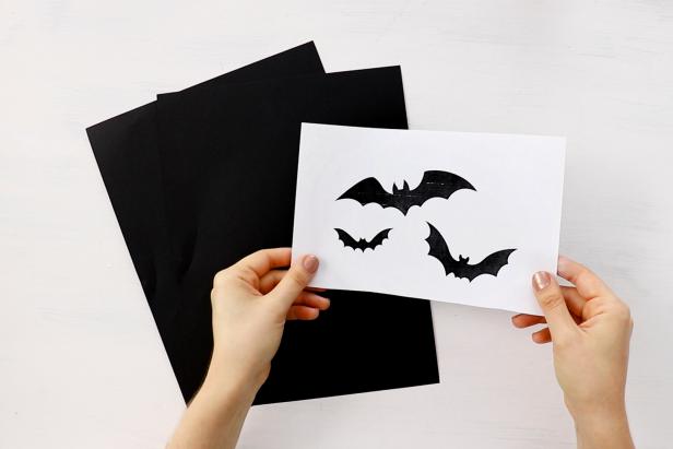 Print out bat silhouettes from the internet. You'll trace them onto black cardstock.