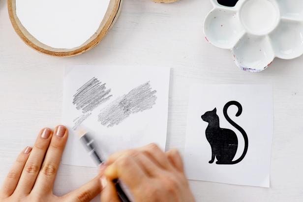 To transfer a printed design, use a pencil to color over the back of the printout. You'll trace over the outlines of the design to lightly transfer the carbon in the next step.