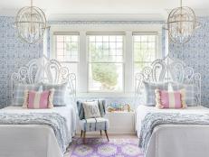 It’s another wallpaper wonder! This design, also by Hygge & West, has drawings of swans, doves, deer, and flowers. With crystal-beaded sphere lights from Capital Lighting and swirly rattan headboards from Serena & Lily, “it’s like a storybook come to life,” says Brittany. Color-block pillows and a shibori chair say tween, not twee.