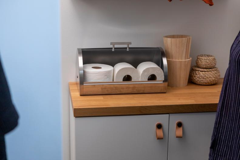 Breadbox used as bathroom storage