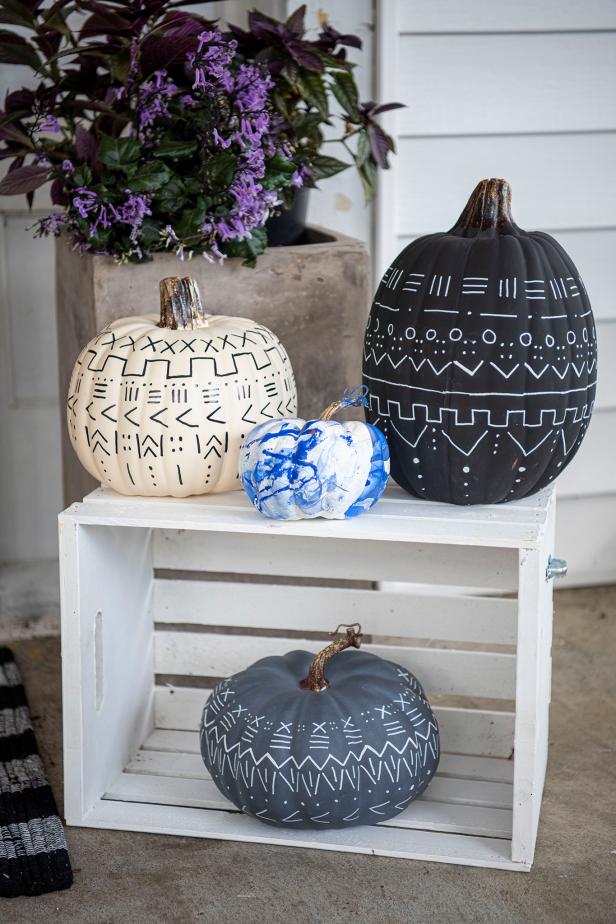 Ditch the gooey mess of carving and opt for painting your pumpkins instead. From ghoulish to glam (like ours), the options are endless.