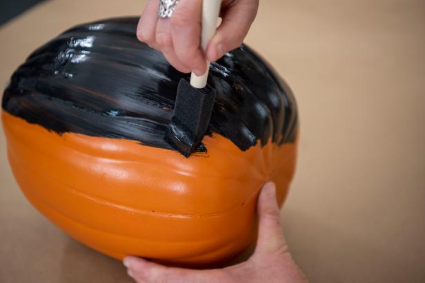 Begin by painting the pumpkin with matte black craft paint and let dry completely.