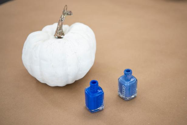 Paint the entire pumpkin white with craft paint and a foam brush.
