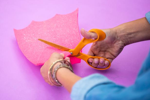 Finally, create flippers out felt sheets by cutting out the shape and including holes for the feet