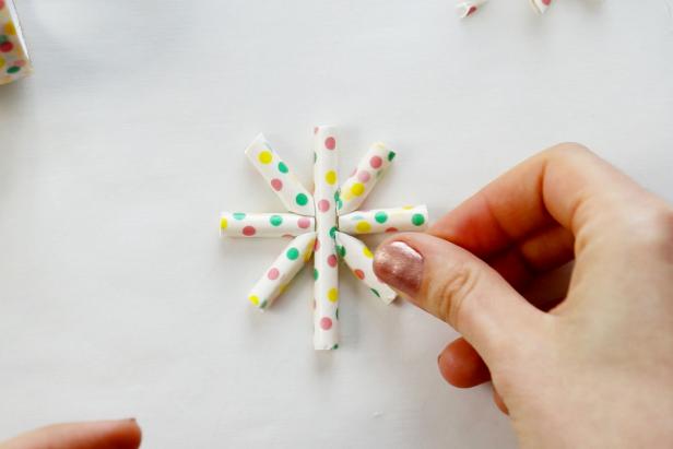 Glue all the pieces together into a starburst shape.
