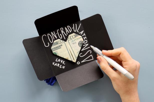 Use a metallic marker to write your message inside. Close the card up and secure it with a small piece of washi tape.