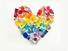 Craft Supplies Arranged by Color to Create a Rainbow Heart
