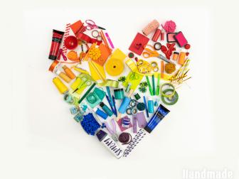Craft Supplies Arranged by Color to Create a Rainbow Heart