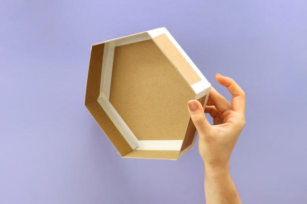 Using masking tape, attach the six rectangles around the hexagon. Fold up each rectangles and tape together.