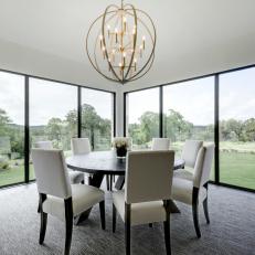 Neutral Dining Room With Orb Chandelier