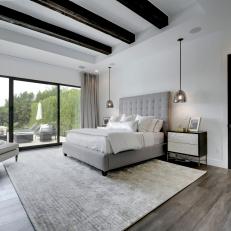 Gray Contemporary Bedroom With Beams