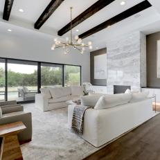 White Modern Living Room With Exposed Beams